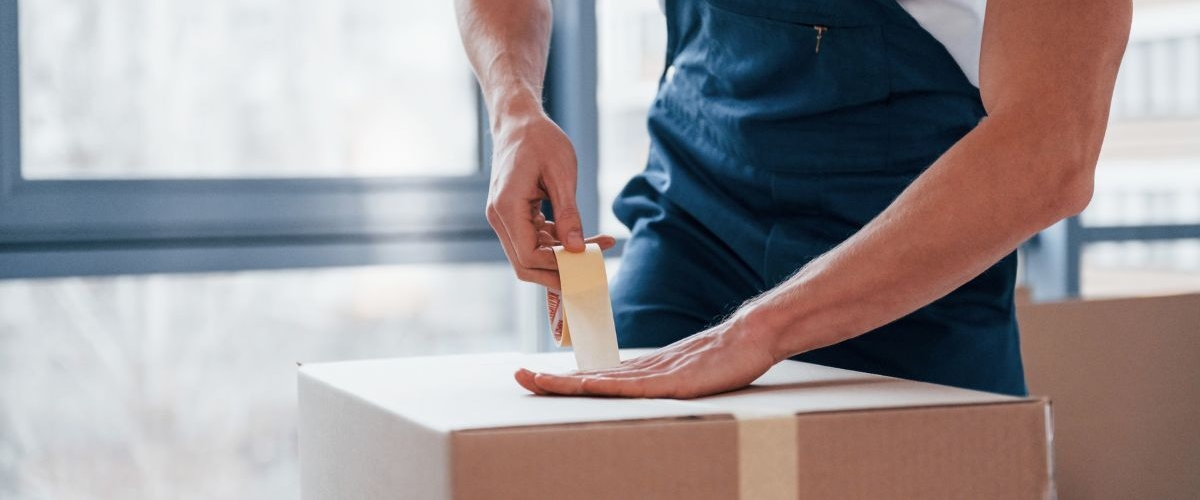 Packing a box and taping it