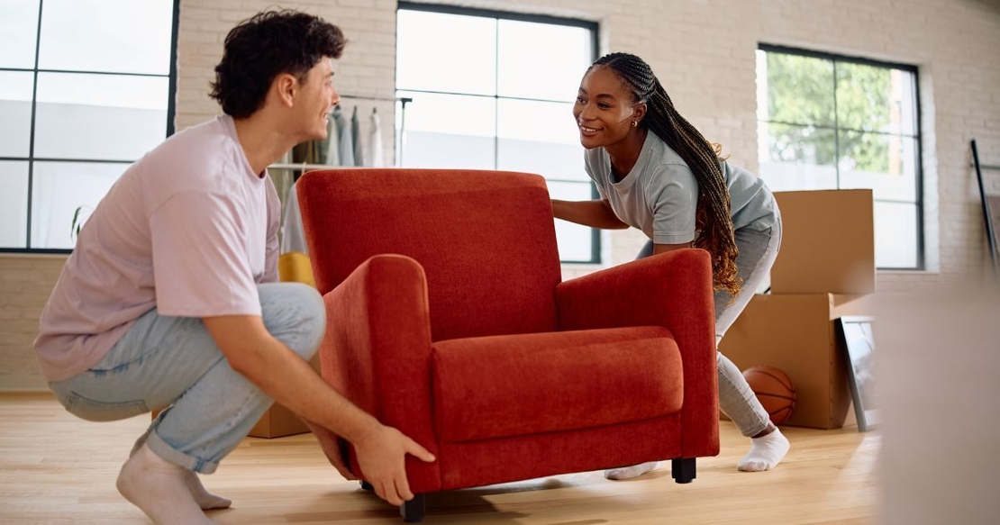 Couple moving red chair