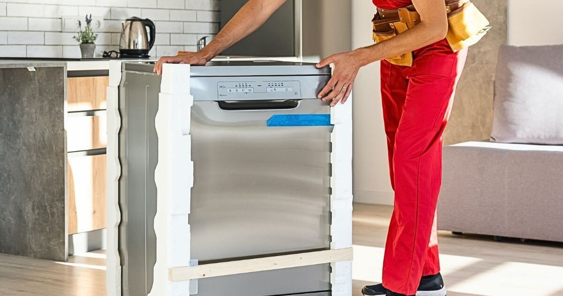 Removalist packing a dishwasher