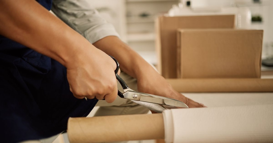 Packing materials with scissors cutting packing paper