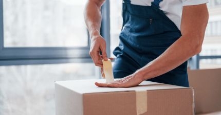 Packing a box and taping it
