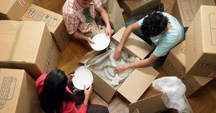 Friends packing dishes