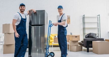 2 removalists moving a fridge